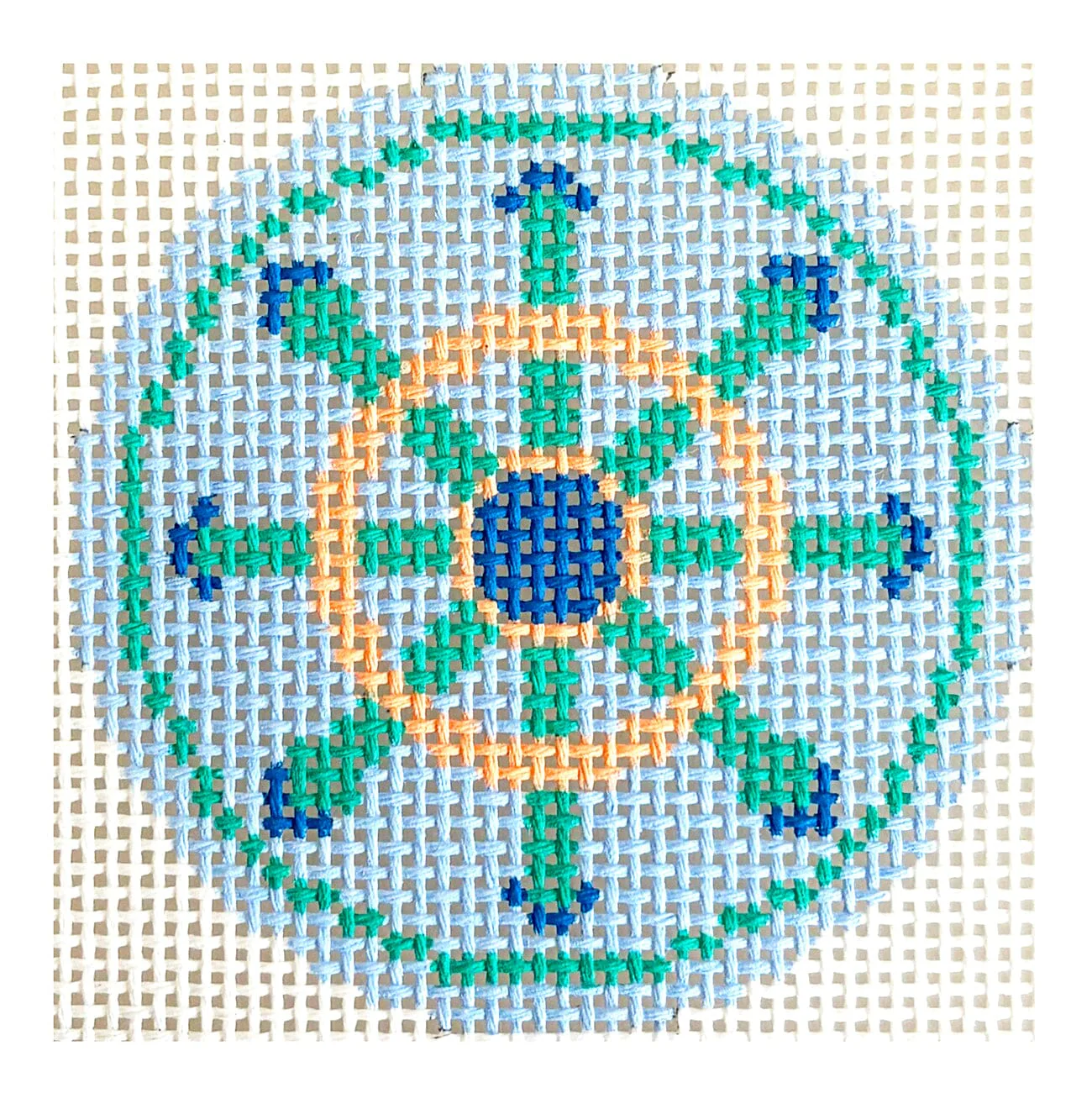 Green and Peach Wheel on Blue Round